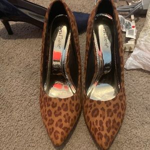 New. Torta Caliente animal print heels. Never worn.